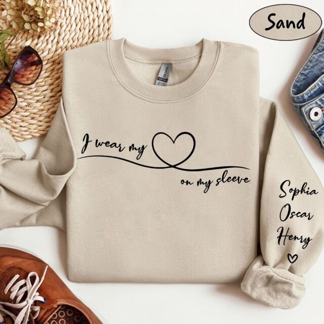 I Wear My Heart On My Sleeve Sweatshirt – Personalized Grandma Shirt with Grandkids’ Names